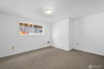 A blank canvas for your style. Freshly painted downstairs bedroom—perfect for a peaceful retreat.
