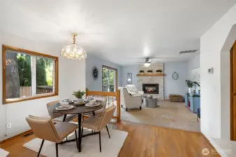 Breakfast nook and family room with gas fireplace.