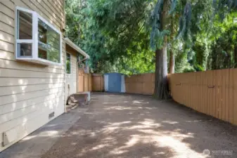 Private, fully fenced, and shaded backyard.