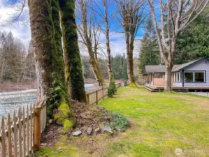 Deck has been updated since this photo was taken in very early spring. (Trees are now in full bloom).