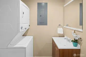 Guest half bathroom plus stacked washer & dryer.