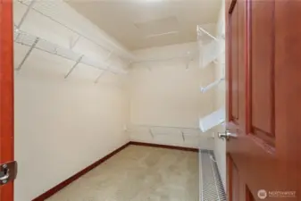 Primary bedroom walk-in closet