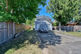 Back of house has access from road and room for cars and toys.
