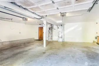 2-car garage houses water thank and furnace and offers entry into lower level of the house.