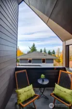 Your own oasis on the upper floor off the primary bedroom with sound and mountain views.