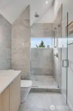 Full Carrara marble throughout bathroom.