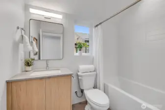 Second bath with shower and tub on upper floor.