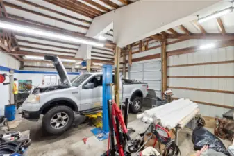 A true standout feature, this oversized shop is built for serious projects. High ceilings, wide bay doors, and durable concrete floors create an ideal workspace for vehicles, tools, or equipment. The professional-grade car lift is included, offering an incredible setup for mechanics, hobbyists, or anyone needing substantial shop space.