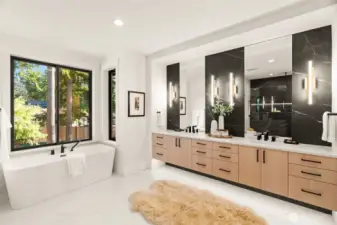 Bright and filled with light primary bathroom, facing private backyard