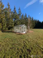 Greenhouse on cement pad.