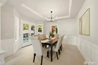 Formal dining with custom wainscoting.