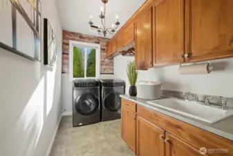 Laundry room w/ large capacity W/D and custom Acorn alderwood cabinets.