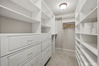 Walk in closet with California Closet built in's.