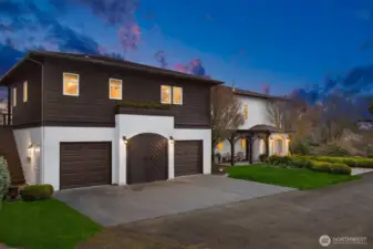 Three car garage with large guest suite above. Separate entrance with power and water meters. Many possibilities here!