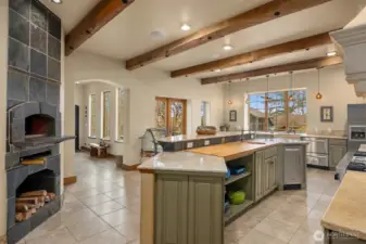 Imported wood fire Italian pizza oven is one of the many appointments in this magnificent kitchen.