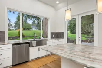 Even doing dishes has a view, the kitchen sink looks out over the fairway.