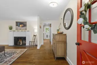 Just inside the entry, a convenient closet stores coats, shoes, bags and life’s other little necessities. To the left, a spacious living room awaits.  Ahead, a passageway leads to the kitchen with a door out to the back yard. A hallway to the right, just before the kitchen leads to the bedrooms and bathrooms. To the left of the fireplace, outside off the frame, another passageway leads to the family room. View the floor plan, included in the photos, to get a feel for the great flow and layout.