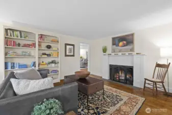The doorway beyond the fireplace leads to the family room. The fireplace chimney was rebuilt in 2023.