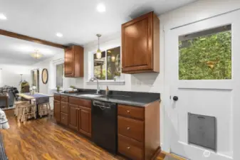 East facing windows along this wall bring morning sunlight into the kitchen, dining, and family room for an inviting, peaceful morning vibe.