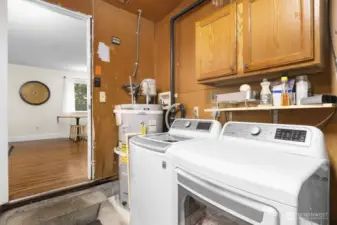 The laundry is located in the garage, just off of the family room.