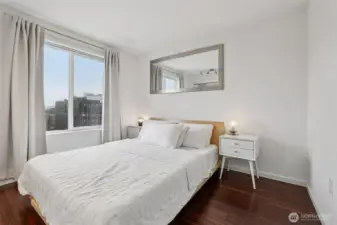 The bedroom is bright, airy and spacious with a custom closet.