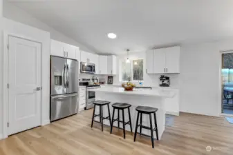 This spacious kitchen features a large island, soft-close cabinets, and ample storage for all your cooking needs.