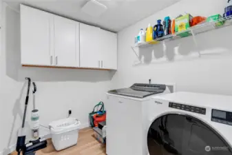 Laundry room with ample storage space.