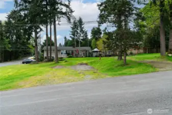 View of future building envelop as seen from NE 83rd St., offering plenty of space to build a large home and private oasis
