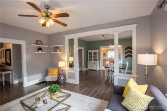 The living room is just off the foyer and flows to the dining room and kitchen.  Gorgeous newer LVP flooring throughout the main and upper level.  The circular floor plan is so practical and feels spacious and open.