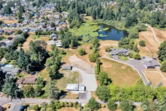 Aerial view of home on spacious 3.59.  acre parcel.