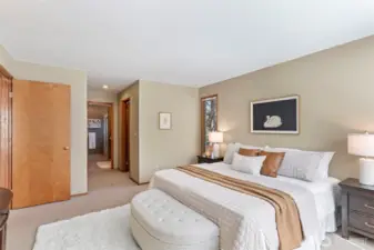 The primary has an ensuite bathroom as well as two walk-in closets.