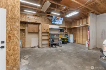 Shop area in garage in front of van.