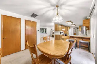 Dining area showing storage and kitchen with eating space