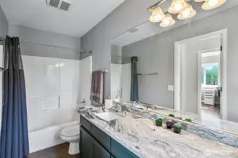 Full bath upstairs with granite counter top and 2 sinks.