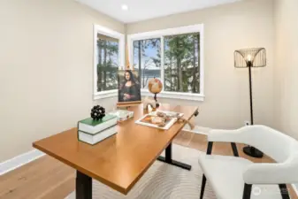 Main-level flexible room ideal for office, guest use, or lifestyle needs.