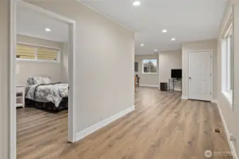 Hallway to the back Family Room with main Floor Bed Room # 2 on the left.