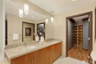 Primary bath has Dual sinks  with granite counter tops and tile backsplash