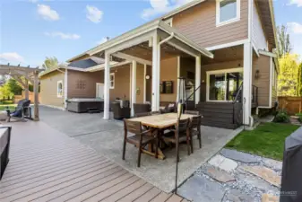 What an amazing back yard oasis for entertaining this home has.  There are several outdoor eating, sitting and playing areas to enjoy family and guests in.  There is also new hot tub pergala and gas firepit to enjoy year around in.