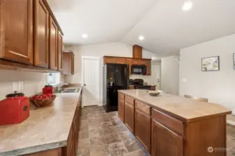 Lots of counter space and alarge walk in pantry to the left of the refrigerator.