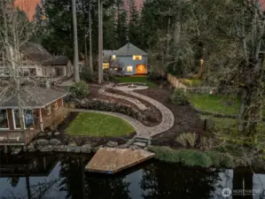 A Birdseye vision of all the opportunity for outdoor living - on Covington Creek with quick access to Lake Sawyer!  (boat house to the left belongs to the neighboring property)