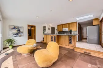 Step from kitchen into entertaining area