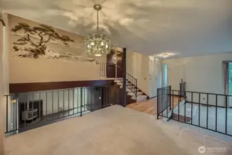Dining room area connects to most of the home - downstairs is rec room area with gas fireplace, upstairs are bedrooms and bathrooms and behind the photo is the kitchen.