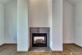 2-sided gas fire place viewed from the living room.