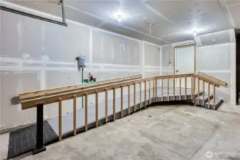New Wheelchair ramp for easy access into the home.  Garage is plenty large with ample room to park cars as well.