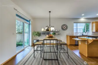 Large dining area off kitchen makes a perfect breakfast nook or can accomodate a large dining table.  There is a separate dining room as well.