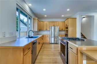 Nicely updated kitchen with lots of counter space and cabinets with newer stainless appliances.  Notice lower counter top to the right for accessible access via wheelchair.