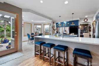 Open kitchen, peninsula bar seating.
