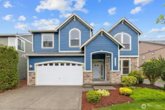 Beautifully landscaped front view of the property.