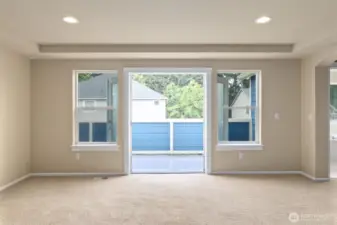 Primary bedroom French doors access to outdoor balcony space.