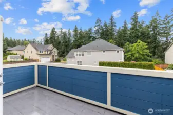 Outdoor balcony space off Primary bedroom.